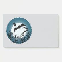 Chauves-souris et arbres contre la lune