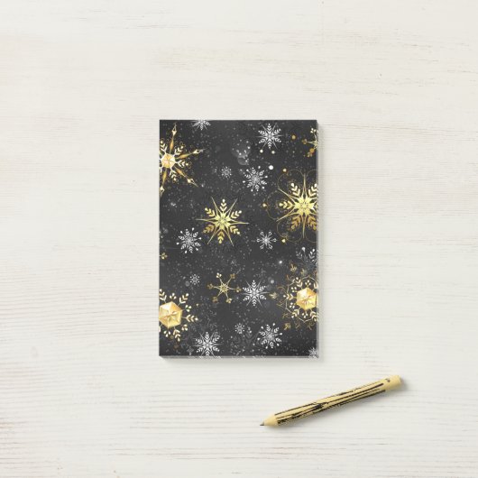 Post-it® Les flocons dorés de Noël sur l'Arrière - plan noi (Sur un bureau)