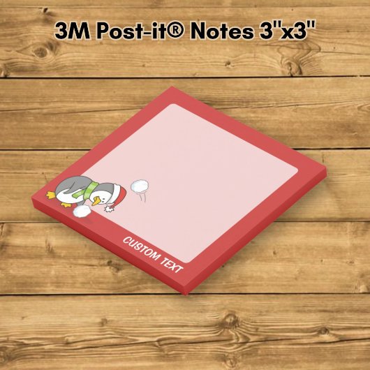Post-it® manchot de Noël ramassant une boule de neige
