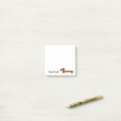 Post-it® Notes collantes d'un chien de teckel de notule (Sur un bureau)