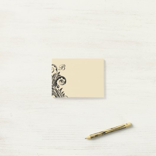 Post-it® Notes de post sur le monogramme floral (Sur un bureau)