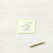 Post-it® Un Dinosaure Anabisetia À Vélo. (Sur un bureau)