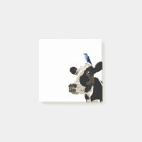 Vache avec un oiseau bleu sur sa tête
