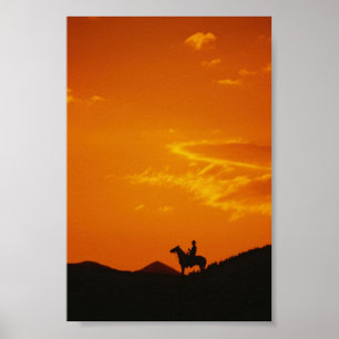 Poster Coucher de soleil orange avec silhouette Cowboy