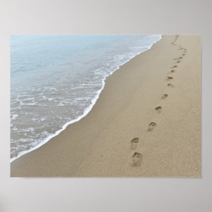 Poster Des empreintes de pieds dans le sable.