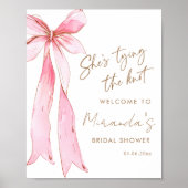 Poster Elle noue l'arc rose de noeud bienvenue (Devant)