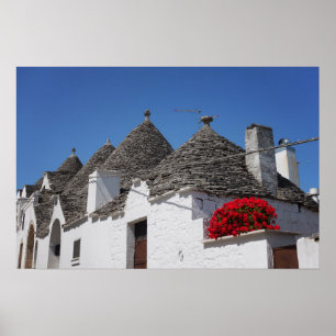 Poster Fleurs de géranium et maisons de trulli à Alberobe