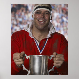 Poster Joueur de rugby tenant la tasse de trophée,