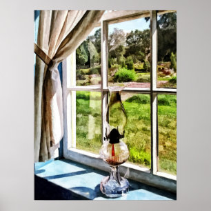 Poster Lampe d'ouragan dans une fenêtre ensoleillée