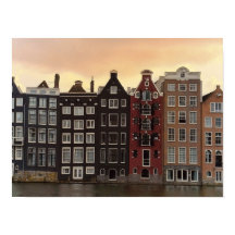 Maisons du canal d'Amsterdam au coucher du soleil