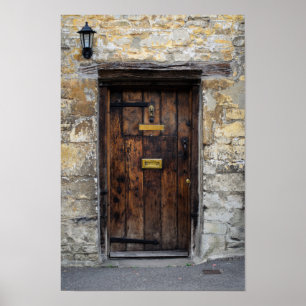 Poster Old wooden front door with light
