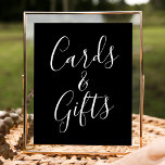Poster Panneau tendance Noir Noir de mariage Cartes et Ca<br><div class="desc">Ce panneau de mariage simple et élégant comprend l'expression "Cartes et Cadeaux" en écriture blanche sur un arrière - plan noir frappant, offrant une touche sophistiquée à votre événement. Personnalisez le signe avec du texte personnalisé en option, comme vos noms, votre date de mariage ou un message de remerciement sincère,...</div>