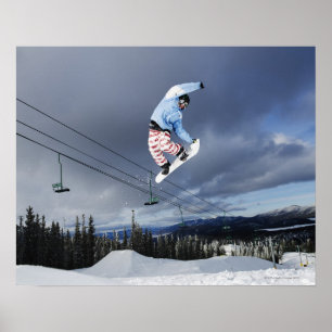 Poster Snowboarder jumping in mid-air doing a backside