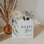 Poster Symbole du livre d'hôtes Floral blanc<br><div class="desc">Nous avons conçu cette enseigne de livre d'hôtes Floral Blanc pour compléter votre mariage tropical foncé rustique. Avec son aquarelle bohème verdoyante et ses fleurs d'hiver boho modernes, dont la protéa, la dahlia et le lotus séché, le design est sûr de mettre en valeur votre moody, minimaliste vert et blanc...</div>