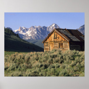 Poster Un cabine en bois et les monts Sawtooth dans