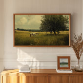 Poster Un cheval blanc paissant dans un champ