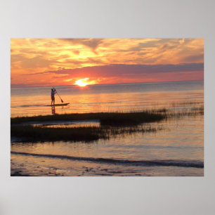 Poster Un homme à la planche à pédales au coucher du sole