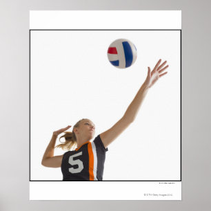 Poster Young girl (16-17) playing volleyball