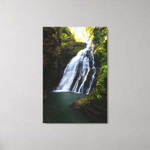 Prachtige waterval met zonlicht gloed canvas afdruk