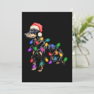 Prettig kerstfeest hond in lichtjes verstrikt feestdagenkaart