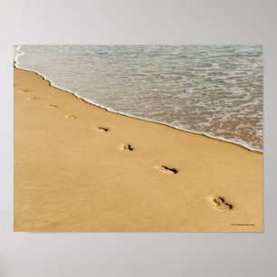 Prints in zand met golven