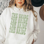 Pull À Capuche Bride Sage Green Customized Matching Bridal Party<br><div class="desc">Are you looking for a unique and personalized bachelorette party outfit? Look no further than the sage green Bride hoodie. This sweatshirt is perfect for your group of girlfriends. It features a fun and colorful design that will match any theme you choose for your bachelorette party. Plus, it's made from...</div>