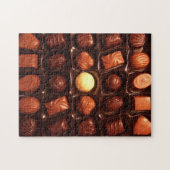 Puzzel die doos van chocoladesnoep kenmerken legpuzzel (Horizontaal)