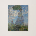 PUZZLE 日傘を差す女（モネ夫人）<br><div class="desc">クロード・モネ（Claude Monet,  1840年11月14日 - 1926年12月5日）は、印象派を代表するフランスの画家。「光の画家」の別称があり、時間や季節とともに移りゆく光と色彩の変化を生涯にわたり追求した画家であった。モネは印象派グループの画家のなかではもっとも長生きし、20世紀に入っても『睡蓮』の連作をはじめ多数の作品を残している。ルノワール、セザンヌ、ゴーギャンらはやがて印象派の技法を離れて独自の道を進み、マネ、ドガらはもともと印象派とは気質の違う画家だったが、モネは終生印象主義の技法を追求し続けた、もっとも典型的な印象派の画家であった。</div>