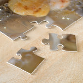 Puzzle Beaucoup de rochers tumblés sur une plage de sable (Côté)