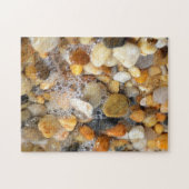 Puzzle Beaucoup de rochers tumblés sur une plage de sable (Horizontal)