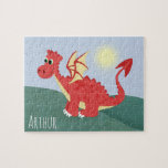 Puzzle Boys mignon et magique Red Welsh Dragon et nom<br><div class="desc">Ce design de puzzle pour enfants mignon et moderne présente un dessin animé de dragon gallois rouge,  bleu ciel et arrière - plan de colline,  et peut être personnalisé avec votre nom de garçon. Le cadeau parfait sur le thème du Pays de Galles pour tout enfant.</div>