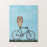 Puzzle Buff Cocker Spaniel Dog assis sur un vélo Vintage<br><div class="desc">Puzzle avec un adorable Cocker Spaniel assis sur une bicyclette à l'ancienne pendant une journée d'été bleue.</div>