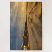 Puzzle Cabines de plage au coucher du soleil sur la côte  (Vertical)