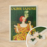 Puzzle Cachou Lajaunie | Leonetto Cappiello<br><div class="desc">Cachou Lajaunie (1920) | L’affiche publicitaire 1920 de Leonetto Cappiello pour Cachou Lajaunie présente une image frappante d’une femme aux cheveux rouges vêtue d’une robe rouge et jaune audacieuse, fumant élégamment contre un riche arrière - plan vert foncé. Les couleurs vibrantes et la pose dynamique de la femme captent immédiatement...</div>