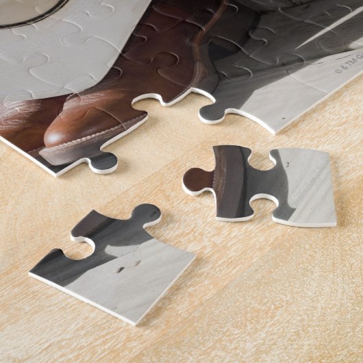 Puzzle Casquette de cowboy sur la rangée de bottes de cow (Côté)