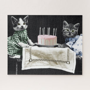 Puzzle Cats celebrating a birthday with cake and candles