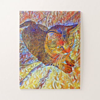 Puzzle Chat tigré brun se reposant sur un lit confortable