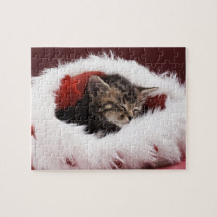 Puzzle Chaton endormi dans le casquette de Noël