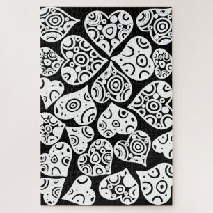 Puzzle Conception de fond de coeurs noirs et blancs migno