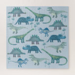 Puzzle Cute Motif de dinosaure bleu préhistorique<br><div class="desc">Un motif amusant de mignons dinosaures sur un arrière - plan bleu. Tyrannosaurus rex, Spinosaurus, Stegosaurus, Diplodocus et Tricératops.</div>