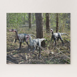 Puzzle de trois dinosaures en course
