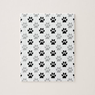 Puzzle Empreintes de pattes de chiots noirs et blancs