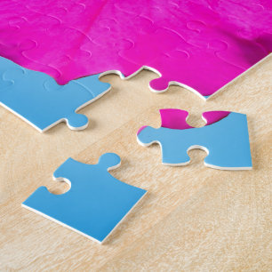 Puzzle fleur pétunia rose en arrière - plan bleu.