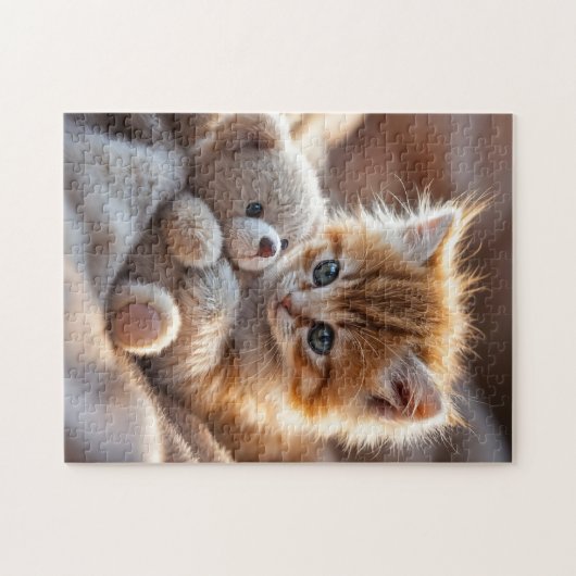 Puzzle Fluffy red kitten playing with a tiny teddy bear, (Horizontal)