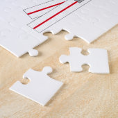 Puzzle Gagnant de slalom, bottes de ski, gants et bâtons (Côté)