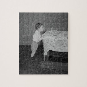 Puzzle Garçon soufflant des bougies