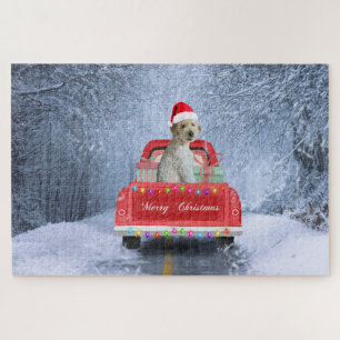 Puzzle Goldendoodle chien dans la neige assis à Noël