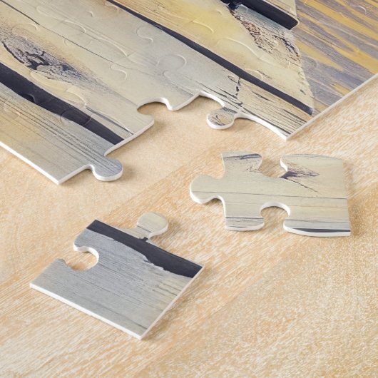 Puzzle kitten on the dock at sunset (Côté)