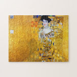 Puzzle La Dame en or, Gustav Klimt<br><div class="desc">Gustav Klimt (14 juillet 1862 - 6 février 1918) était un peintre symboliste autrichien et l'un des membres les plus en vue du mouvement de la sécession de Vienne. Klimt est réputé pour ses peintures, peintures murales, croquis et autres objets d'art. Le sujet principal de Klimt était le corps féminin,...</div>