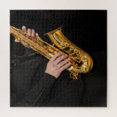 Puzzle Le joueur saxophone joue du jazz avec des mains sa (Vertical)